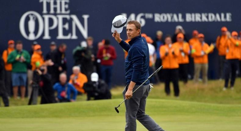 US golfer Jordan Spieth celebrates on the 18th green of the Royal Birkdale golf course on July 23, 2017