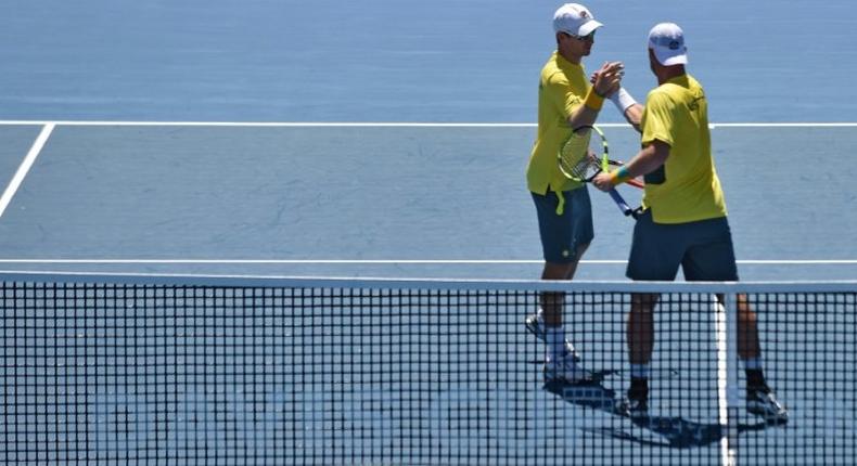 Australia's Sam Groth (R) and Jon Peers celebrate beating Jiri Vesely and Jan Satral of the Czech Republic in their Davis Cup World Group doubles rubber, at Kooyong in Melbourne, on February 4, 2017