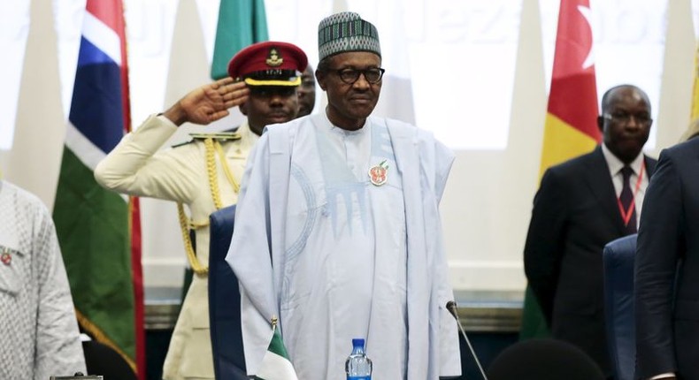 Nigeria's President Muhammadu Buhari (C) stands at the opening of the 48th ordinary session of ECOWAS Authority of Head of States and Government in Abuja, Nigeria, December 16, 2015 REUTERS/Afolabi Sotunde