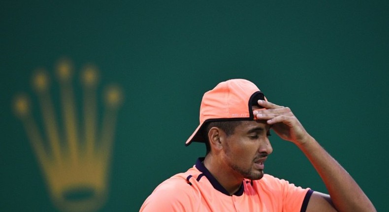 Australia's Nick Kyrgios clashed with the chair umpire and a heckler and admitted not trying after he lost 6-3, 6-1 to German qualifier Mischa Zverev