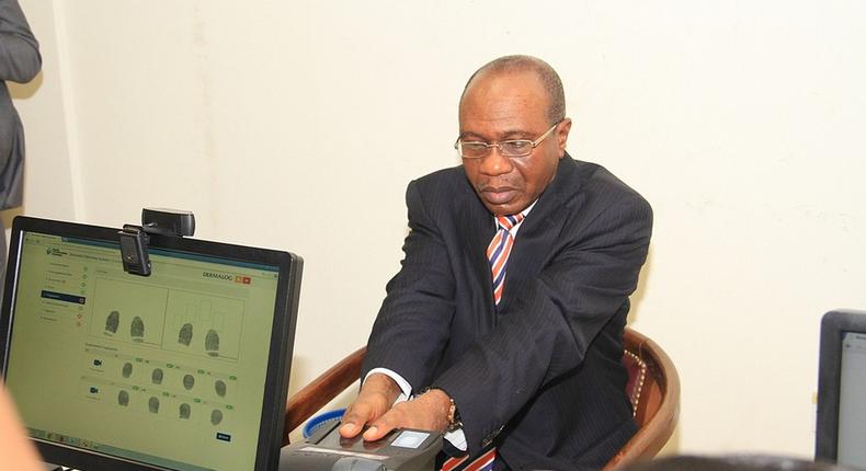 Godwin Emefiele, suspended Governor of the Central Bank of Nigeria during a biometric exercise. 