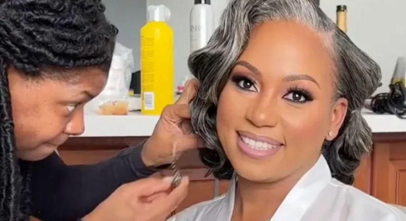 Bride doing her makeup