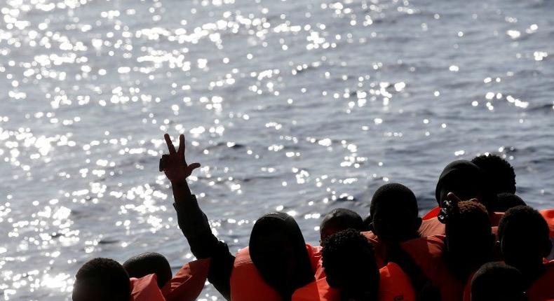 Migrants are seen during rescue operation in the Mediterranea Sea October 20, 2016. 