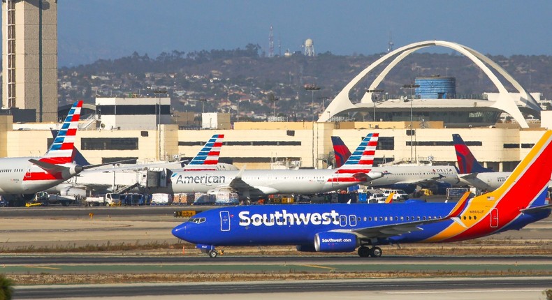 A Southwest Airlines plane lands at Los Angeles International Airport.
