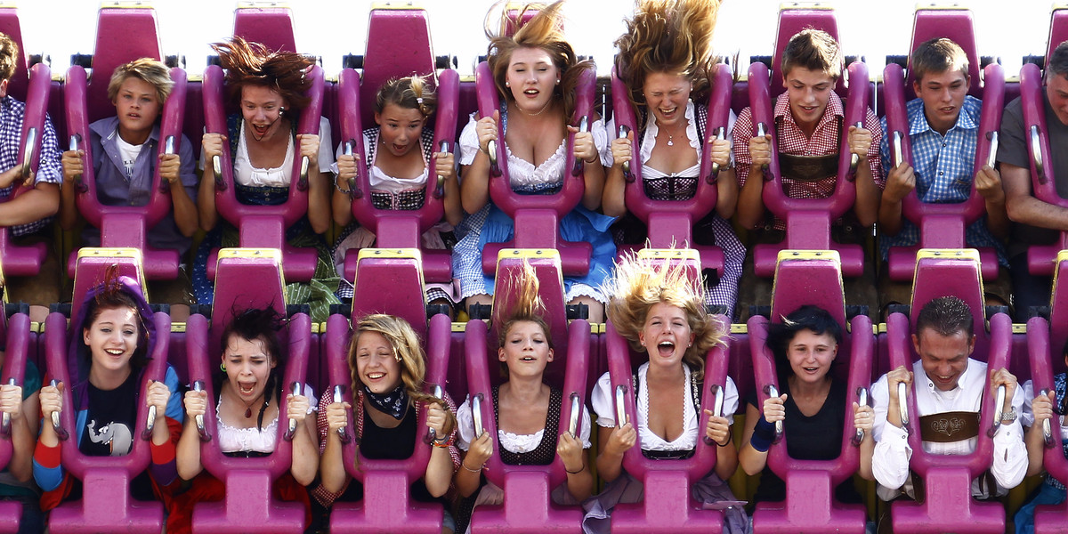 Revellers enjoy a ride in a roller coaster after the opening of the World's biggest beer fest, the Munich Oktoberfest, at the Theresienwiese in Munich, September 17, 2011.