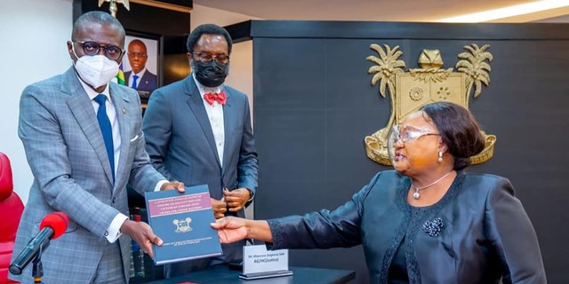 Lagos State governor, Babajide Sanwo-Olu (left), receives the report of the Judicial Panel of Inquiry from panel chairperson, the retired Justice Doris Okuwobi (right) [LASG]