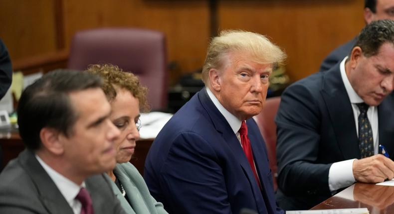 Former President Donald Trump sits at the defense table with his defense team in a Manhattan court, Tuesday, April 4, 2023.AP Photo/Seth Wenig, Pool
