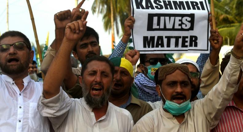 Protesters in Karachi shout slogans during a rally to show solidarity with people of Indian-administered Kashmir on August 5