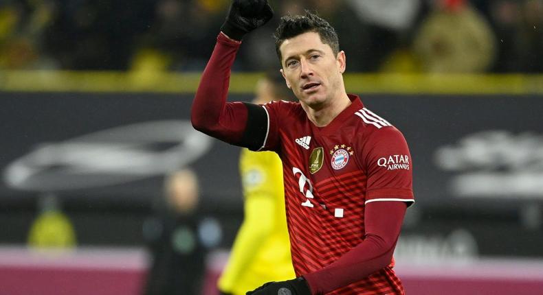 Robert Lewandowski scored twice for Bayern in a 3-2 win at Borussia Dortmund after finishing second to Lionel Messi in the Ballon d'Or voting