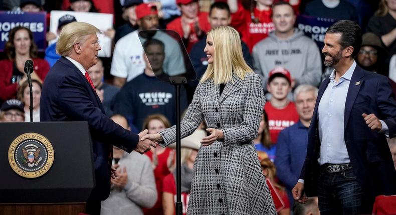 Former President Donald Trump greets his daughter Ivanka Trump and son Donald Trump Jr. during a Keep America Great rally at Southern New Hampshire University Arena on February 10, 2020.
