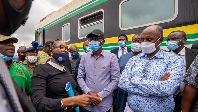 Lagos State governor, Babajide Sanwo-Olu (middle), and the Minister of Transportation, Rotimi Amaechi (right) [LASG]