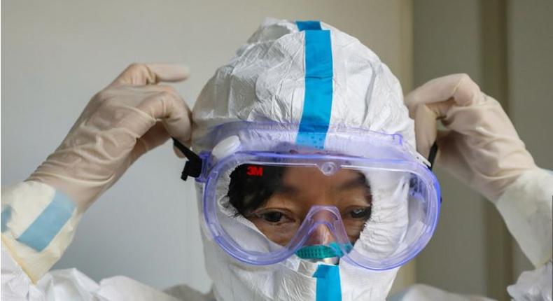 File image of a person wearing a protective facemask