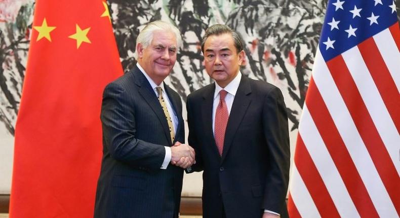 China's Foreign Minister Wang Yi (right) shakes hands with US Secretary of State Rex Tillerson after a joint press conference in Beijing, on March 18, 2017