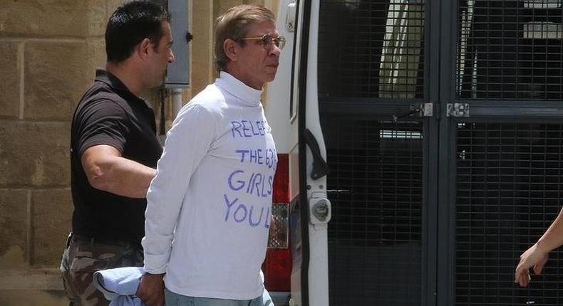 Egyptian Seif Eldin Mustafa (R), who hijacked an EgyptAir passenger plane, is transferred by Cypriot police from the court back to the prison in Nicosia, Cyprus May 13, 2016. 