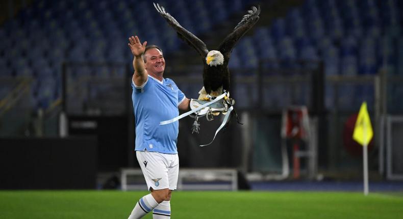 Juan Bernabe holds Lazio mascot Olimpia before their Europa League match with Lokomotiv Moscow Creator: ANDREAS SOLARO