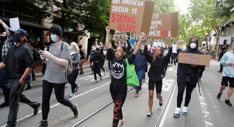 FILE PHOTO: Protesters rally against the death in Minneapolis police custody of George Floyd, in Portland, Oregon, U.S. May 31, 2020. REUTERS/Terray Sylvester/File Photo