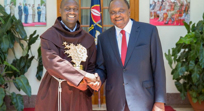 President Kenyatta with teacher Peter Tabichi