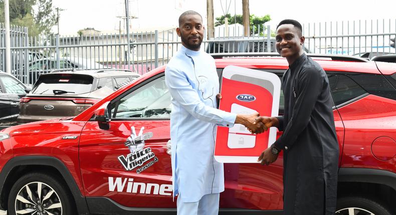 L-R: Managing Director of Elizade Autoland (authorized distributor of JAC vehicles in Nigeria), Mr. Demola Ade-Ojo, making a presentation of a JAC SUV to the Winner of The Voice Nigeria Season 4, Pere Jason, at the head office of JAC Nigeria, Lagos, recently.