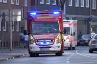 An ambulance arrive near a place where a vehicle drove into a group of people killing several and injured many in Muenster