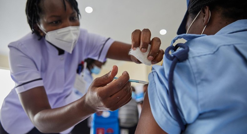 Woman getting vaccinated in Kenya