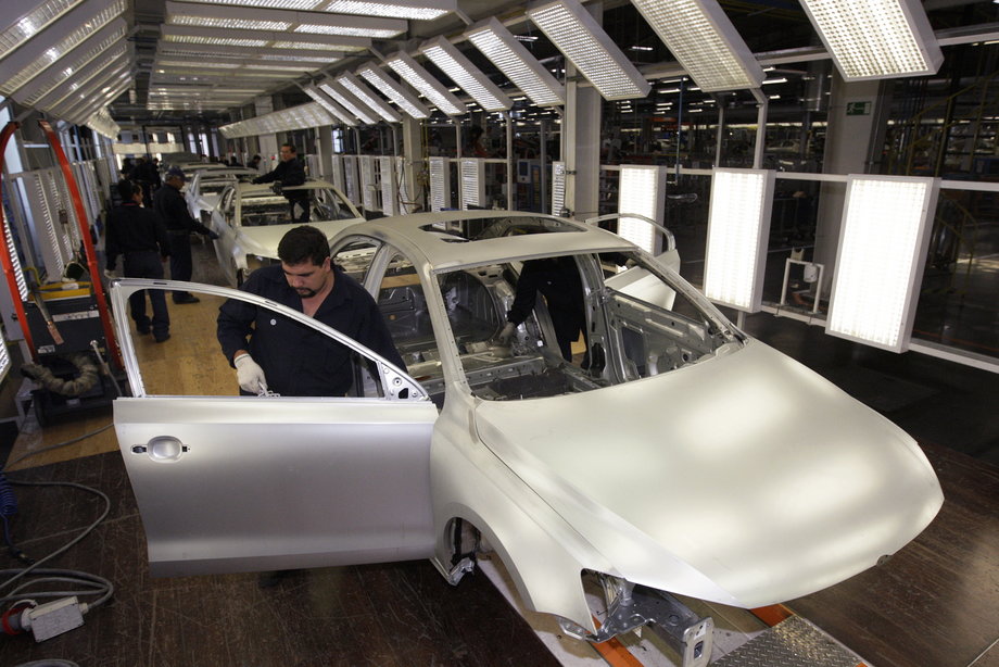 Employees work on the assembly line on the Jetta Bicentennial at the Volkswagen (VW) automobile manufacturing factory in Puebla, Mexico, August 12, 2010.