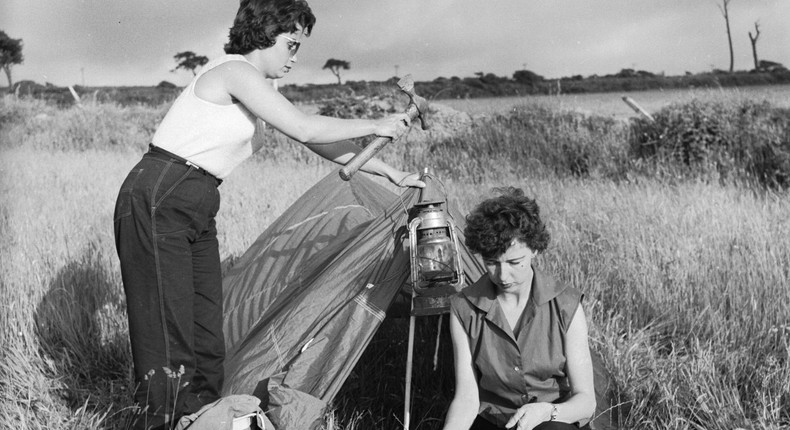 Two women setting up camp in 1956.Harry Kerr/Stringer/Getty Images