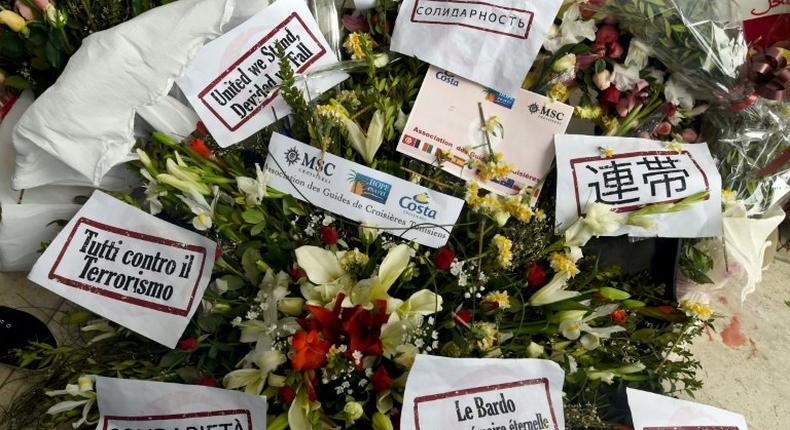 Flowers and messages of condolences are laid outside Tunisia's Bardo National Museum on March 24, 2015 in Tunis, six days after it witnessed an attack which killed 21 people