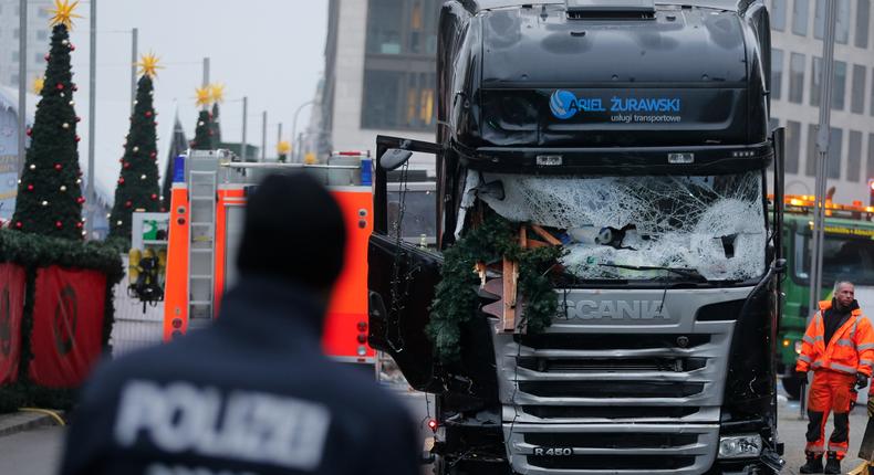 Police in front of the truck that plowed into a crowded Christmas market in Berlin, Germany, on Monday.