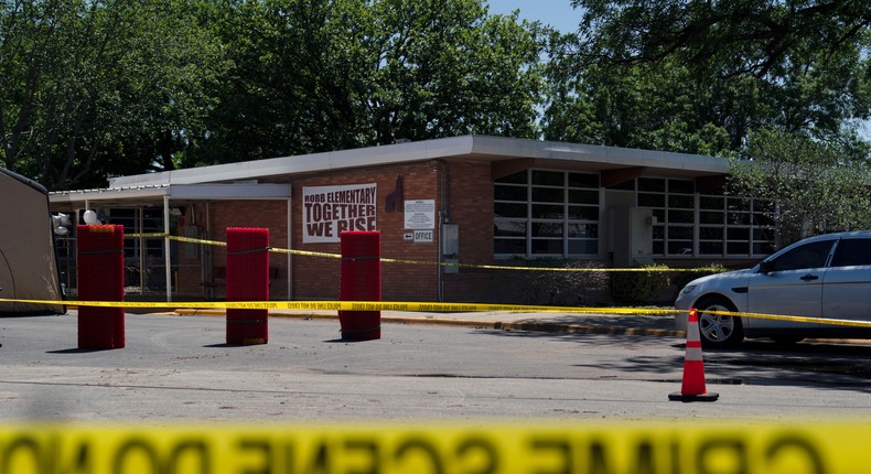 Crime scene tape surrounds Robb Elementary School in Uvalde, Texas, Wednesday, May 25, 2022.