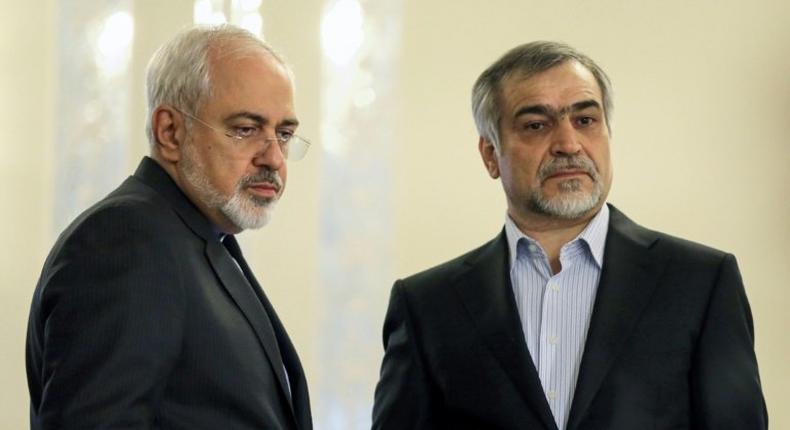 This file photo taken on April 3, 2015 shows Hossein Fereydoun (R) alongside Iranian Foreign Minister Javad Zarif at a news conference in Tehran