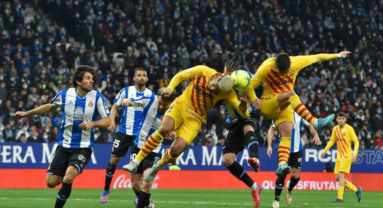 Barcelona's Uruguayan defender Ronald Araujo (L) took a knock against  Espanyol Creator: Pau BARRENA