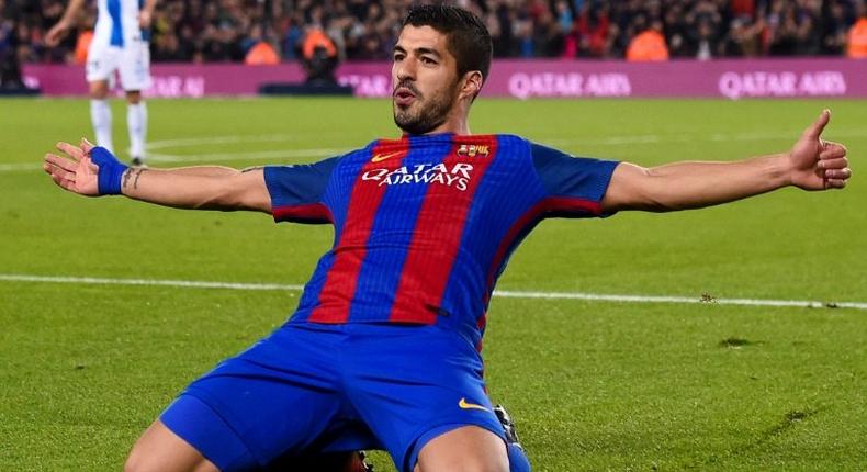 Barcelona's forward Luis Suarez celebrates a goal on December 18, 2016