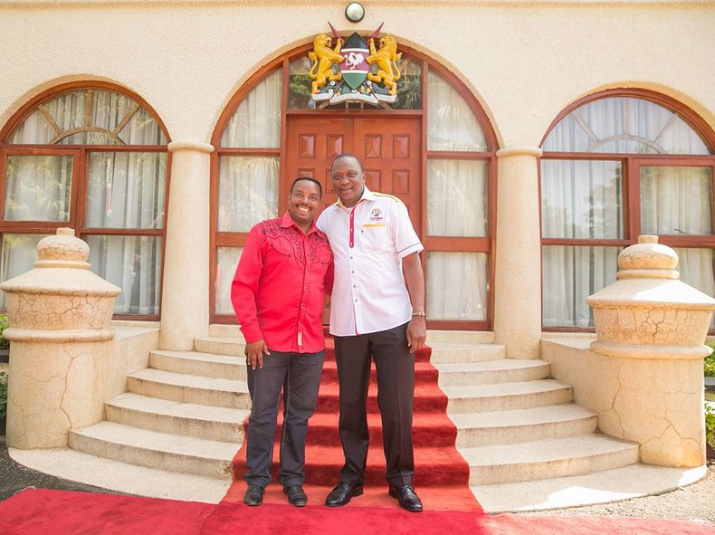 File image of Ben Githae with former President Uhuru Kenyatta