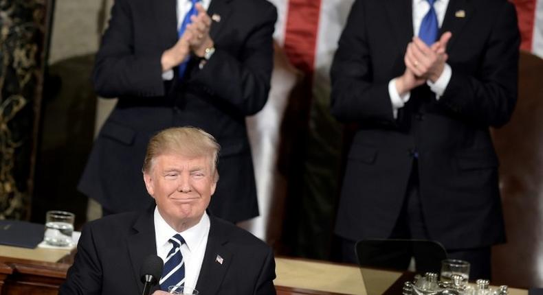 US President Donald Trump pauses for applause while speaking during a joint session of Congress on Capitol Hill February 28, 2017 in Washington, DC