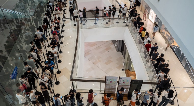 Customers in Guangzhou, China line up to enter an Apple store.John Ricky/Anadolu via Getty