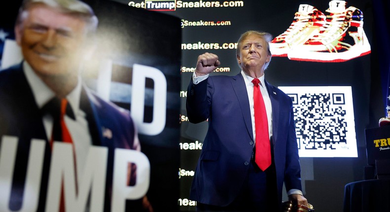 Former President Donald Trump holds a pair of his Trump-branded shoes.Chip Somodevilla/Getty Images