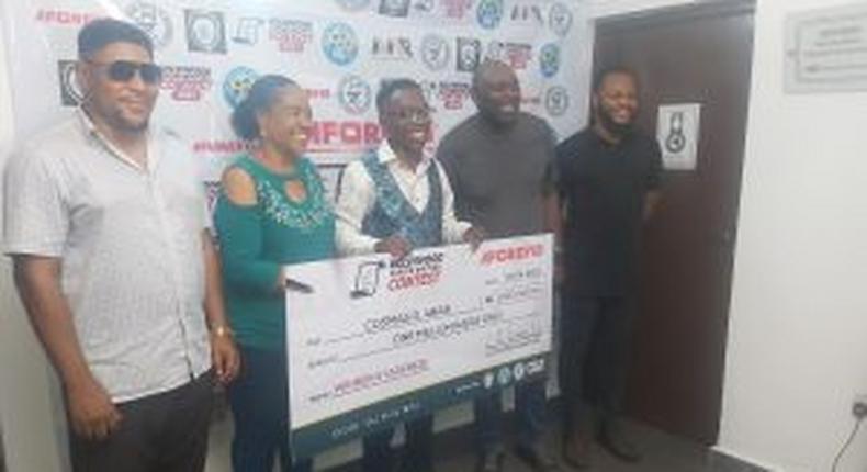 Middle is Mr Cosmos Abasi, winner of the Nollywood Screenwriting contest who was rewarded with N1m.