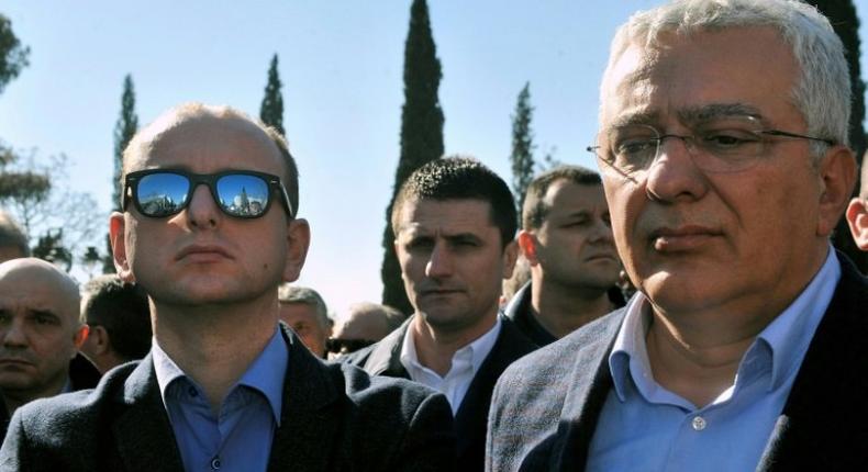 Montenegro lawmakers Andrija Mandic (right) and Milan Knezevic attend an opposition rally in Podgorica, on February 15, 2017