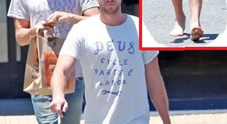 Liam Hemsworth goes barefoot in Malibu