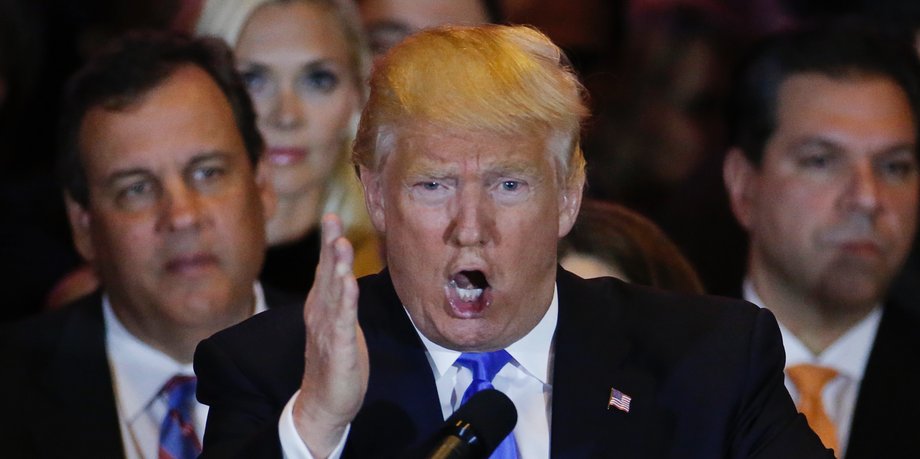 Republican US presidential candidate Donald Trump speaks, as New Jersey Gov. Chris Christie (left) looks on, during Trump's five-state primary-night event in New York City on April 26.