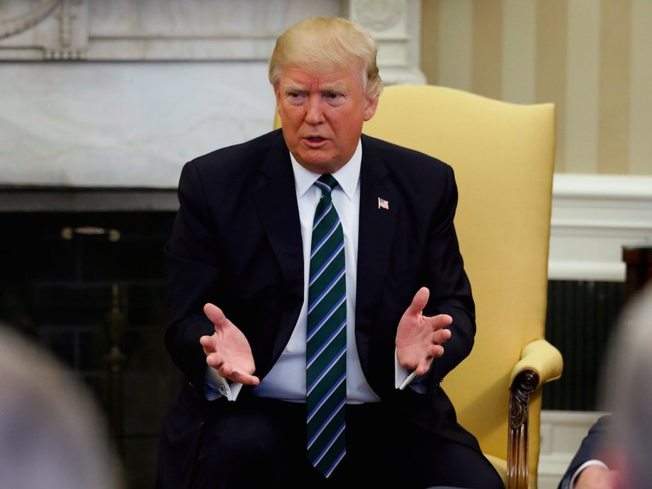 U.S. President Donald Trump (C) and Vice President Mike Pence (L) meet with U.S. Representative Mark Walker (R-NC) (R) and members of the Republican Study Committee at the White House in Washington, U.S. March 17, 2017.