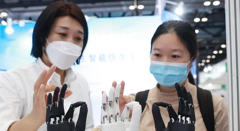 A staff member introduces intelligent bionic hands at the Care And Rehabilitation Expo China 2021 on Beijing, China.
