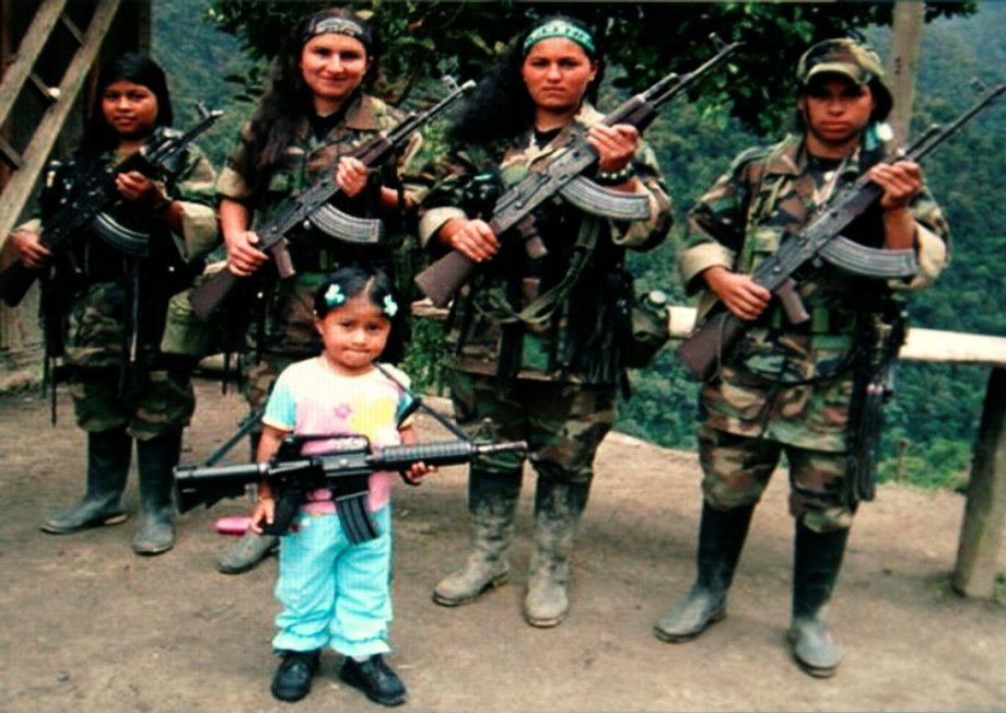 FARC rebels pose with an unidentified girl holding a weapon in southern Colombia.