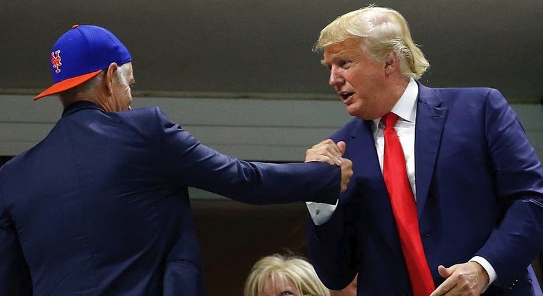 John McEnroe shakes hands with then-Republican presidential candidate Donald Trump.