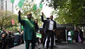 (Left) Consul-General of Nigeria in New York, Amb. Lot Egopija and New York City Mayor, Mr Eric Adams raising Nigeria flag at a Carnival to commemorate 62nd Nigeria Independence Day in New York on Saturday in New York.