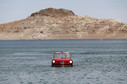 James Spears takes his 1964 German built Amphicar for a drive on Lake Mead in Nevada