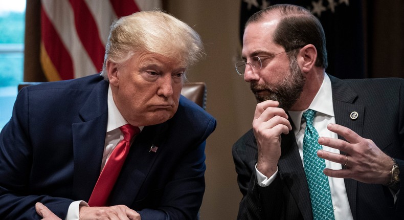 Former US President Donald Trump speaks with former Secretary of Health and Human Services Alex Azar during a meeting with the White House Coronavirus Task Force in Cabinet Room of the White House on March 2, 2020.
