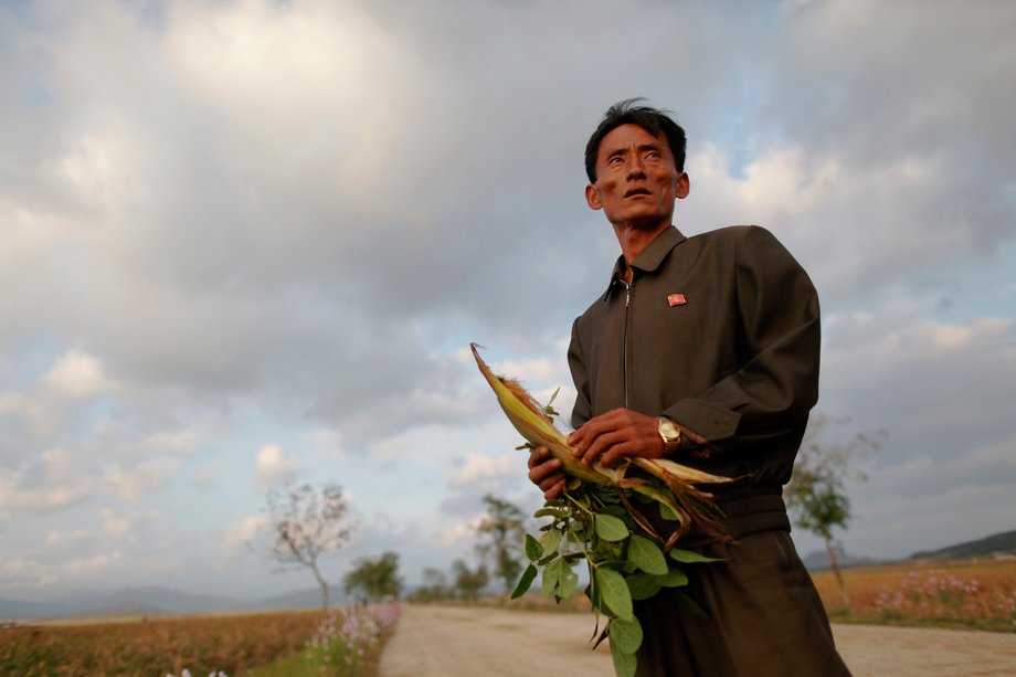 Pak Su Dong, manager of the Soksa-Ri cooperative farm in an area hit by floods and typhoons, shows damage to agricultural products in the South Hwanghae province September 29, 2011.