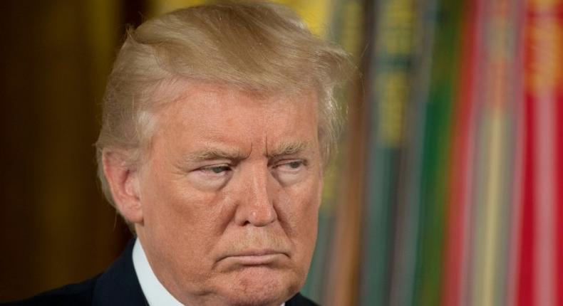 US President Donald Trump, seen here at a Medal of Honor ceremony at the White House, says a Russia sanctions bill is significantly flawed but signs it anyway