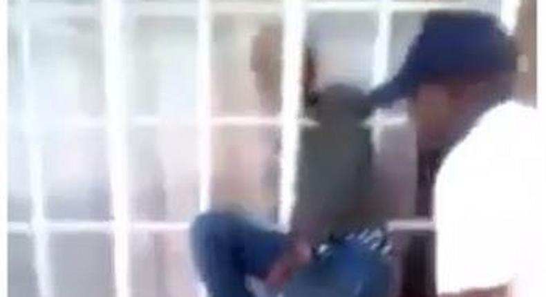 Homeowner beats thief as he gets stuck in burglar-proof (Video)